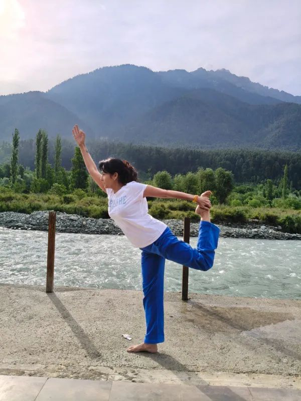 Dancer’s pose by the river